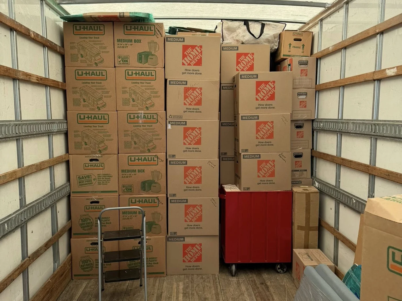 Stacked moving boxes prepared inside a truck
