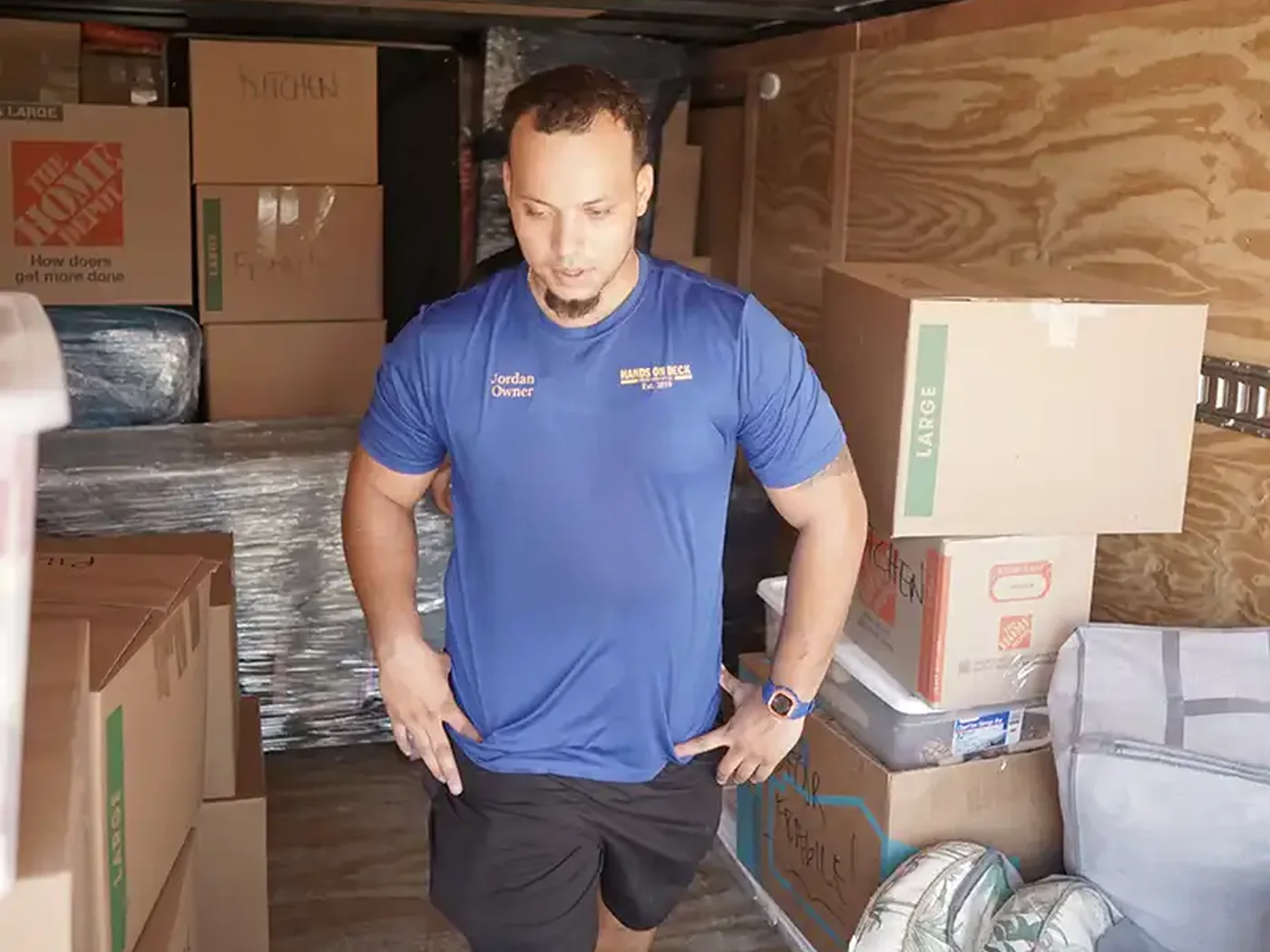 Hands On Deck owner Jordan Grimm inside a loaded moving truck