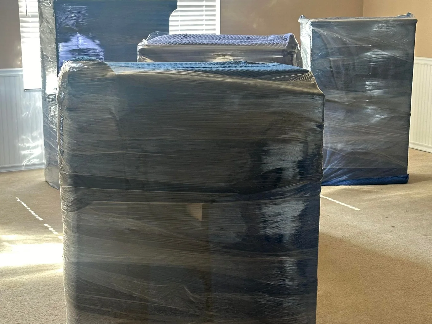 Commercial furniture wrapped and protected before moving