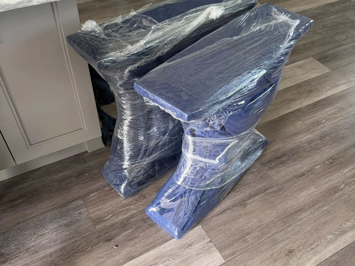 Furniture components wrapped and grouped for moving