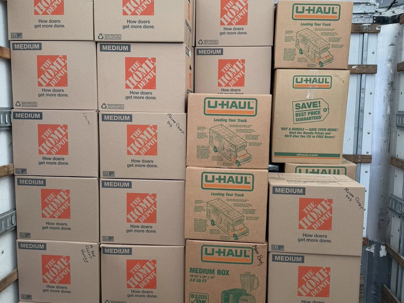 Moving boxes stacked inside a truck before transport