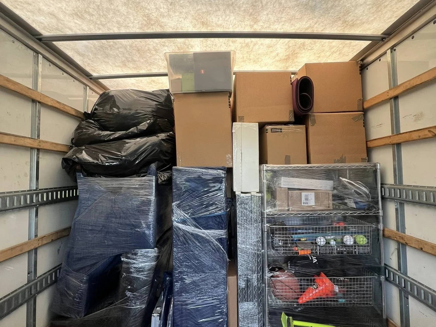 Organized Hands On Deck moving truck loaded for a household move