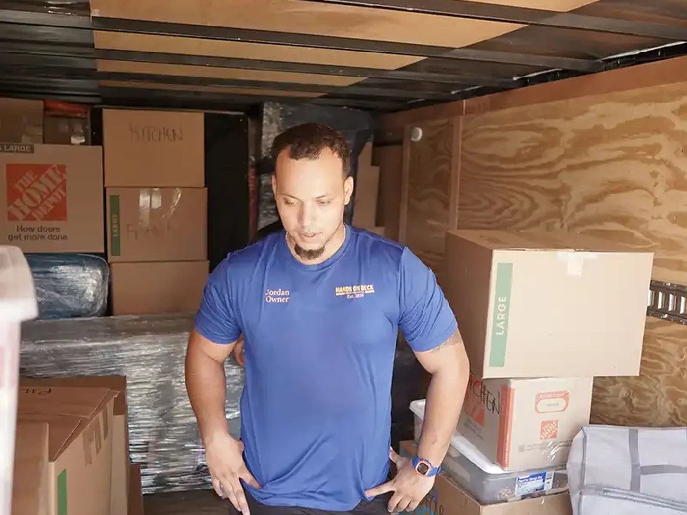 Hands On Deck mover working inside a loaded moving trailer