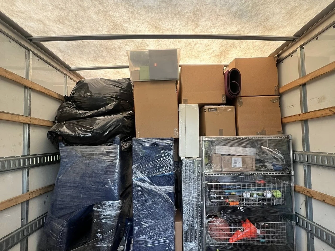 Household goods and protected items organized inside a moving truck