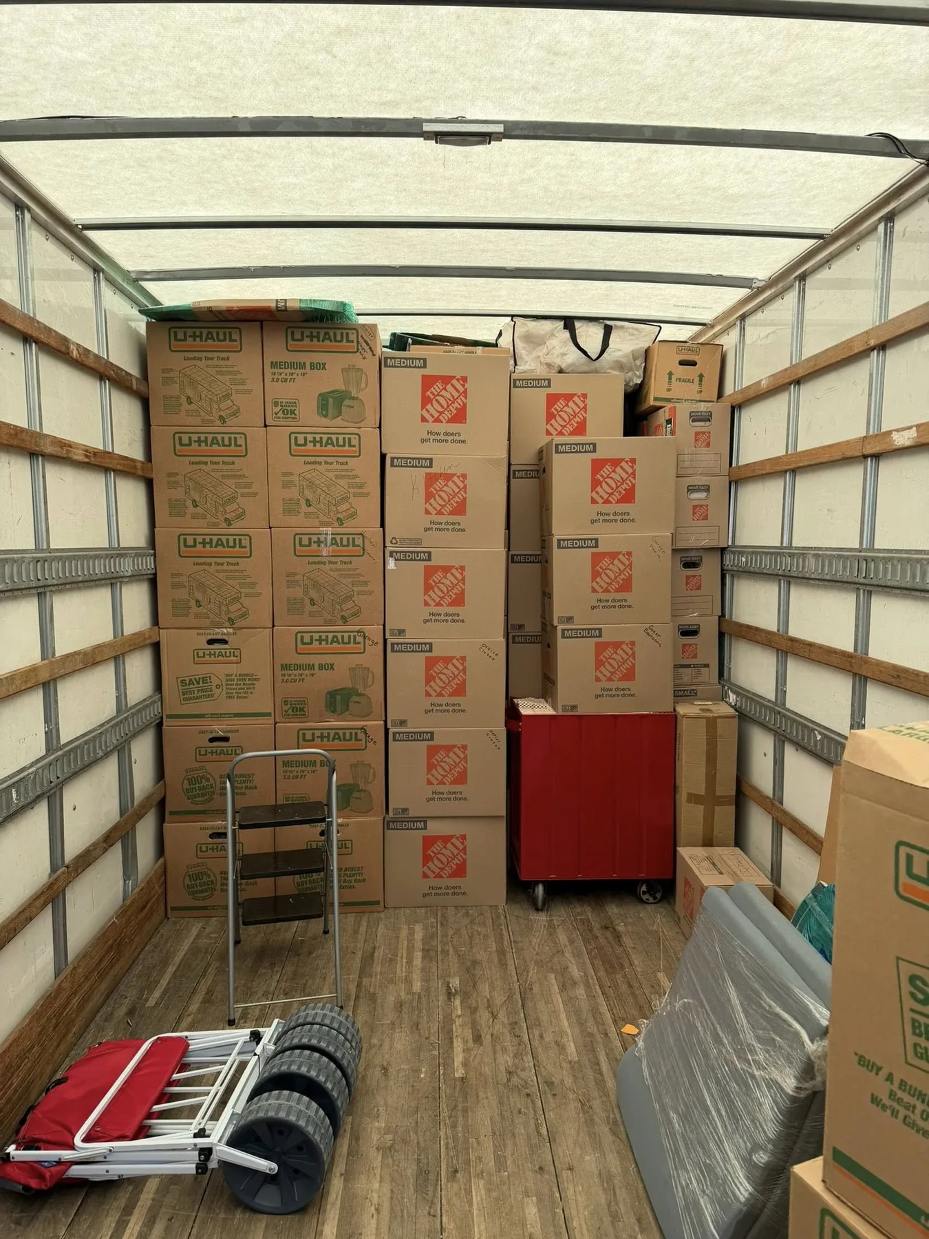 Boxes stacked and secured inside a moving truck