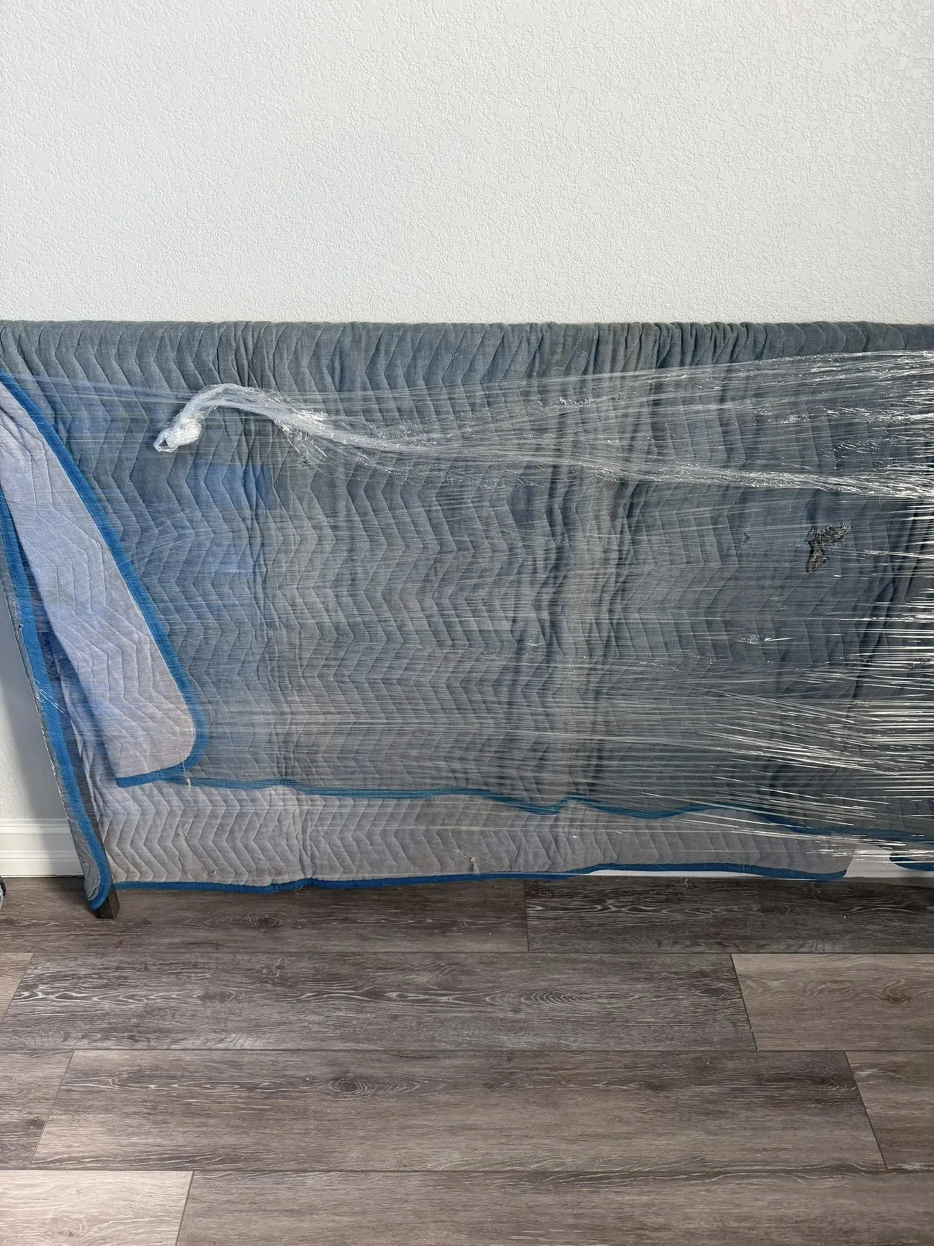Household furniture protected with moving blankets
