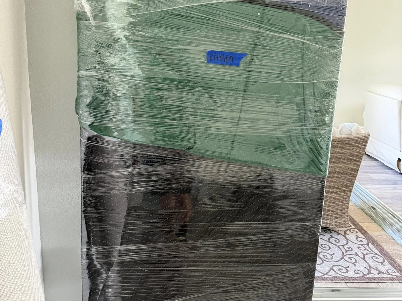 Household furniture protected with stretch wrap before moving