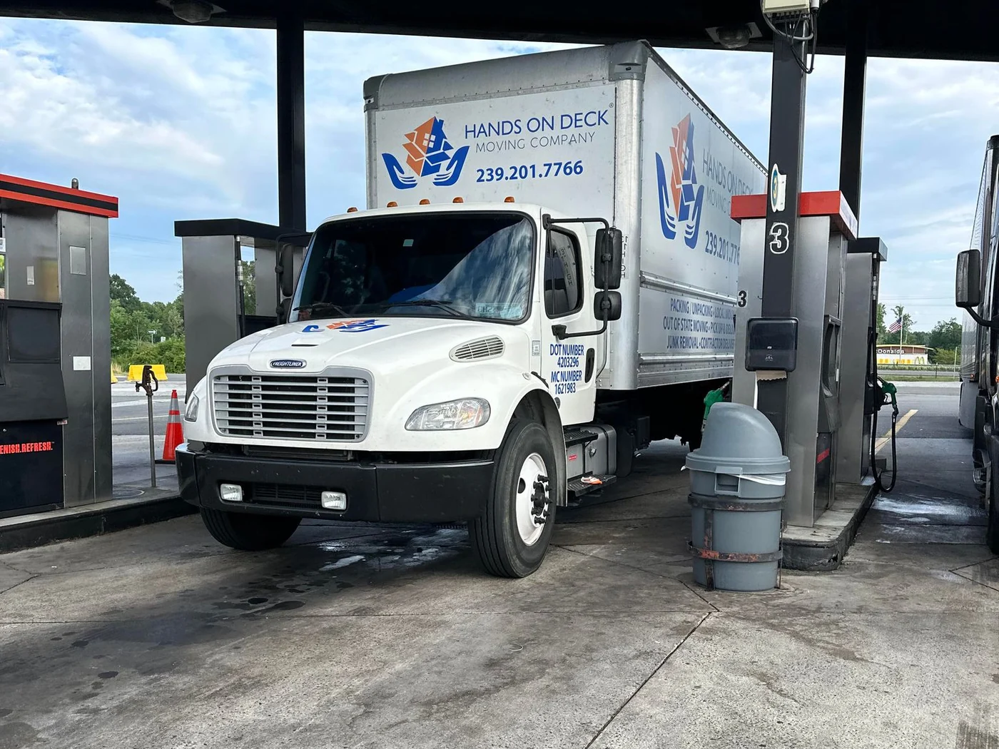 Hands On Deck moving truck on the road during a moving job