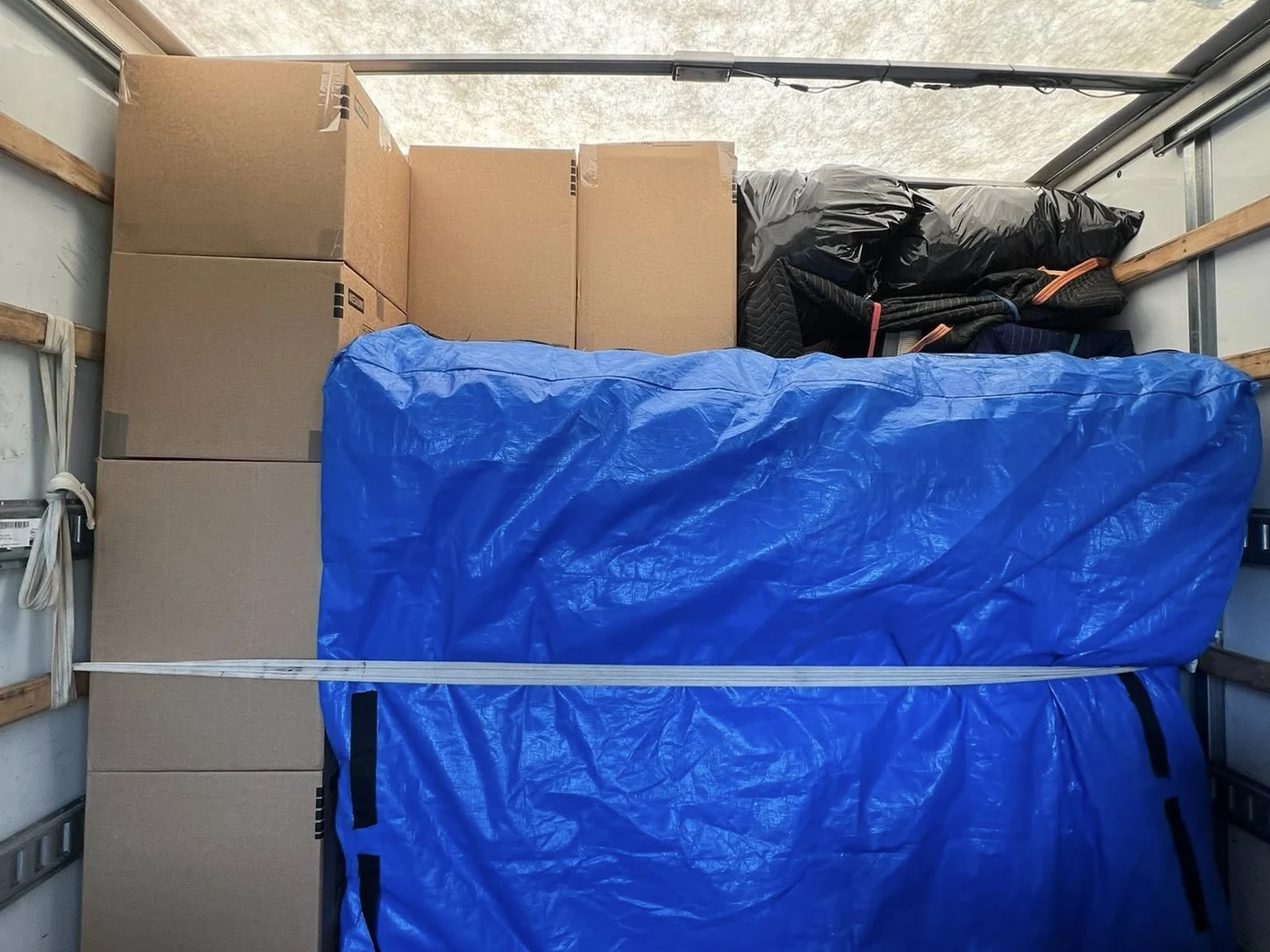 Boxes and furniture protection secured inside a moving truck