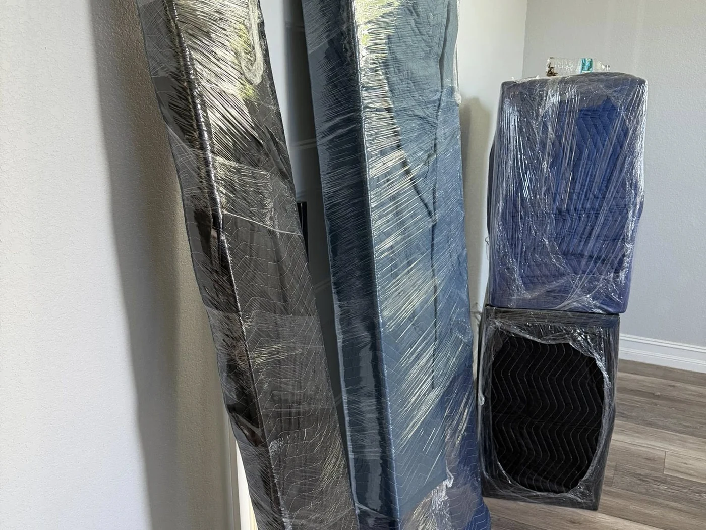 Tall household items wrapped and protected before a move