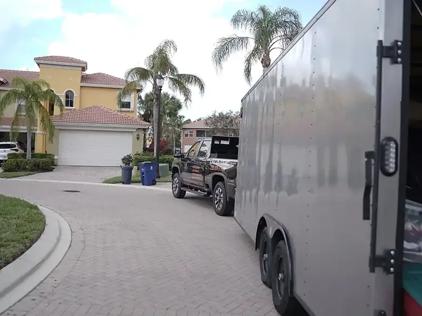 Moving trailer staged near a Southwest Florida residential property
