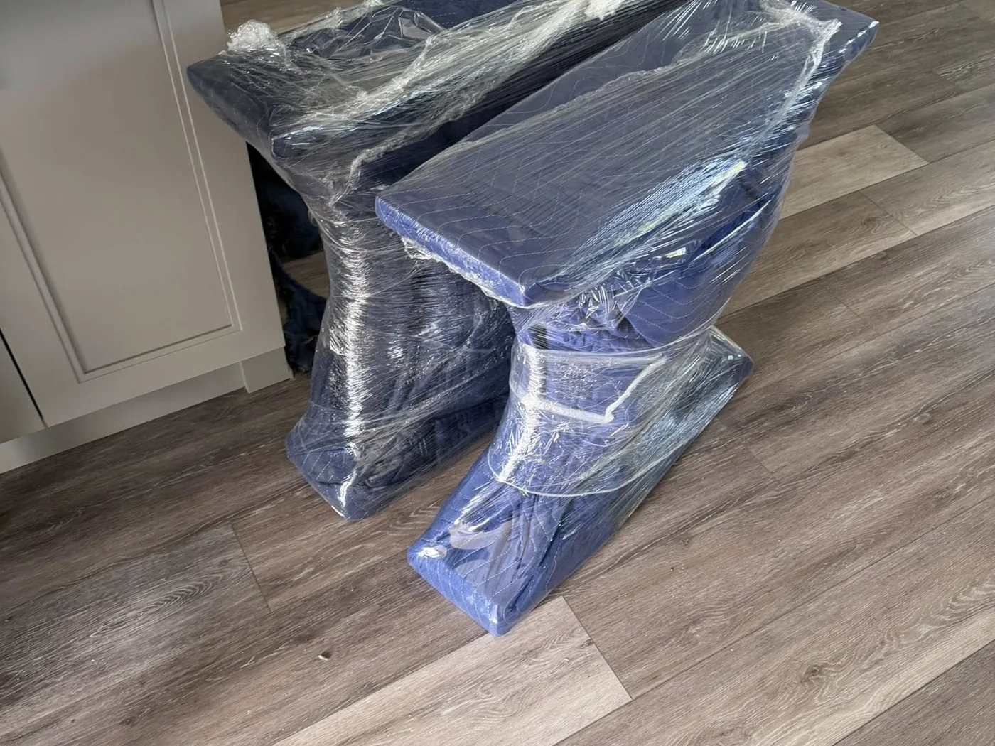 Furniture pieces wrapped for protection before moving