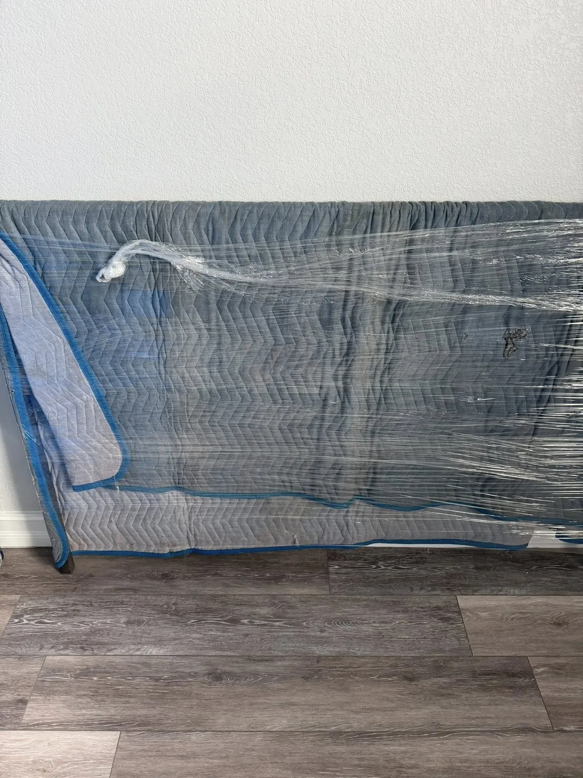 Furniture protected with moving blankets before transport